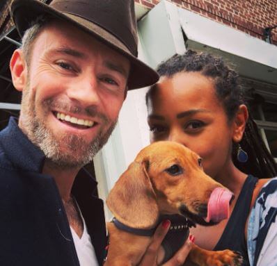 Ben Taylor with his wife Melanie Liburd and dog.
